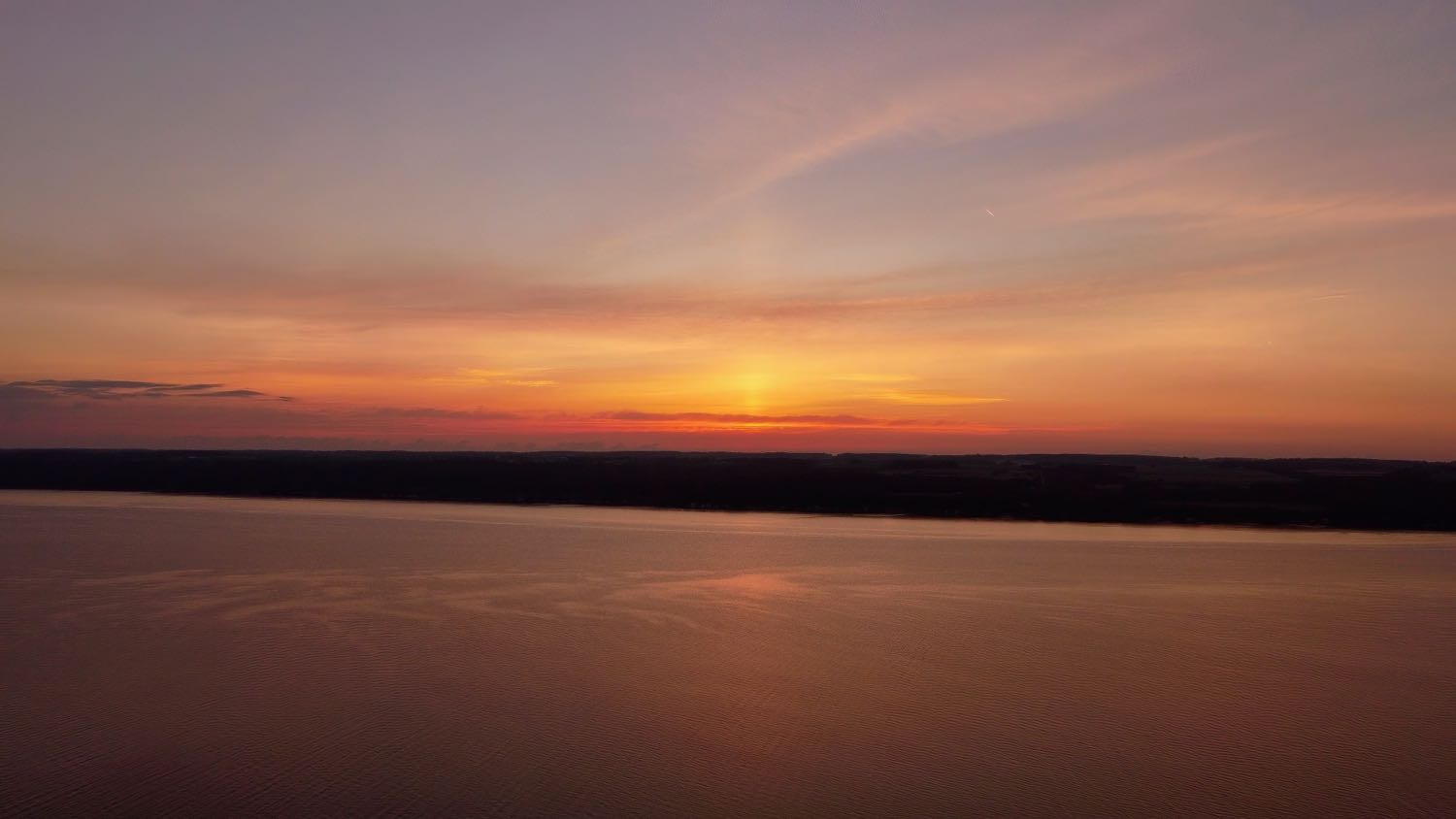 Aerial photo of sunrise over Cayuga Lake