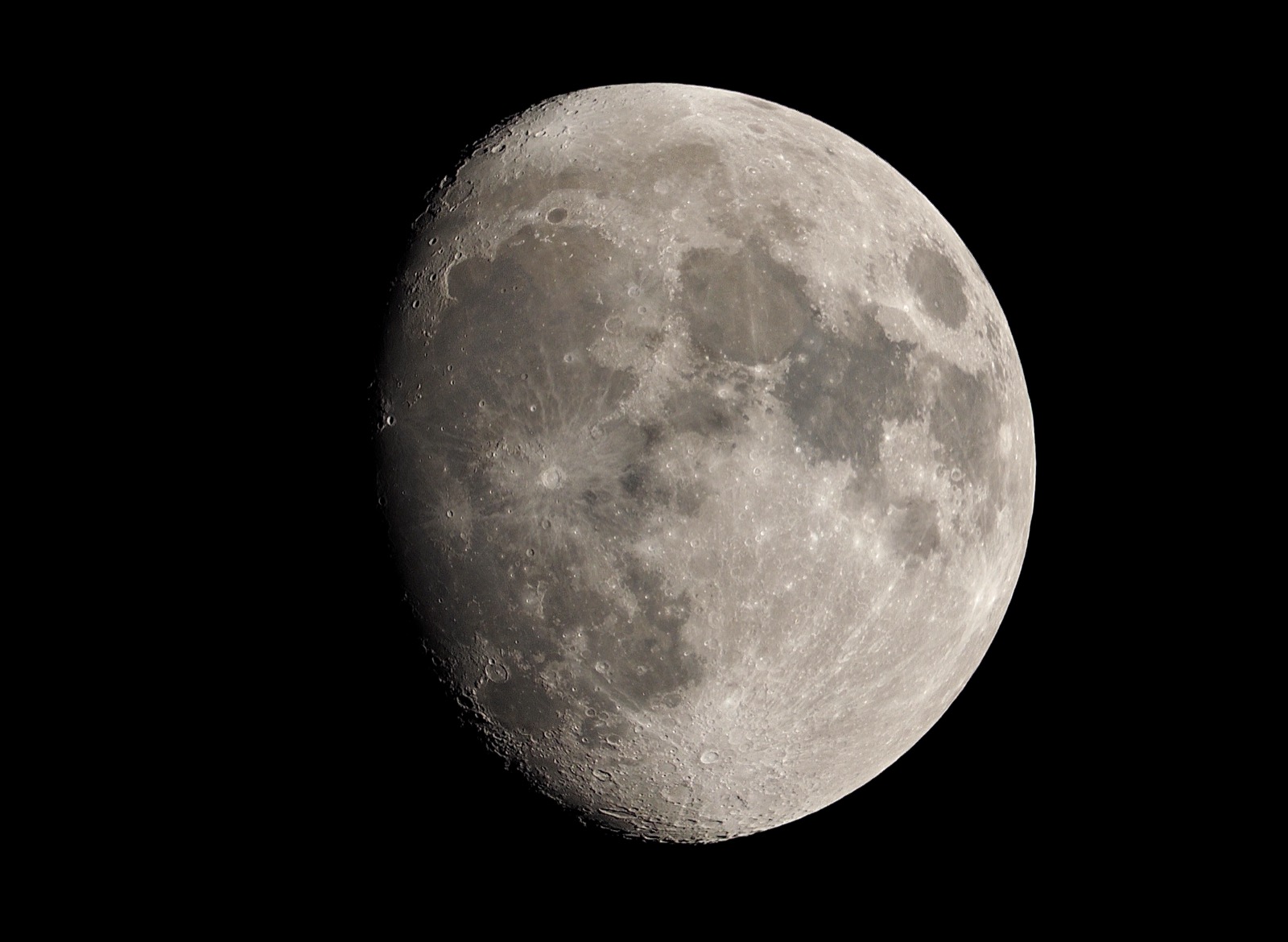 Telephoto closeup of a waxing gibbous moon
