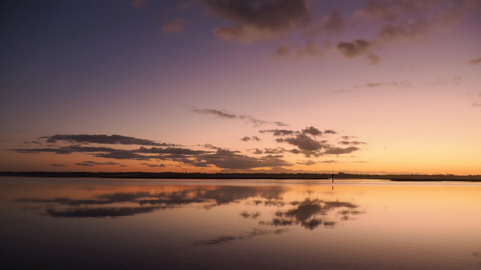 Clouds refleced on the Tolomato River, part of the Intracoastal Waterway, looking east toward ocean minutes before sunrise