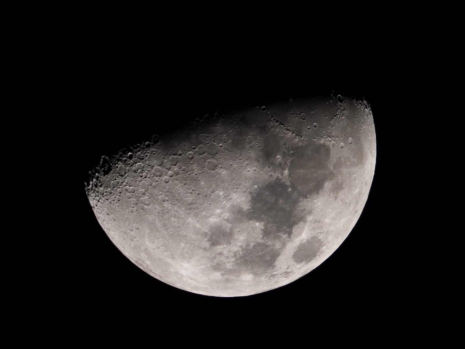 Telephoto closeup of the waxing gibbous moon, 55.5% illuminated