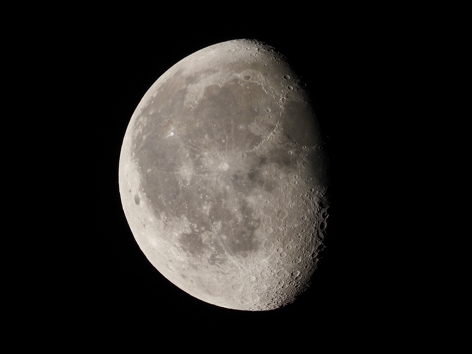 Closeup of the waning gibbous moon, 77% illuminated.