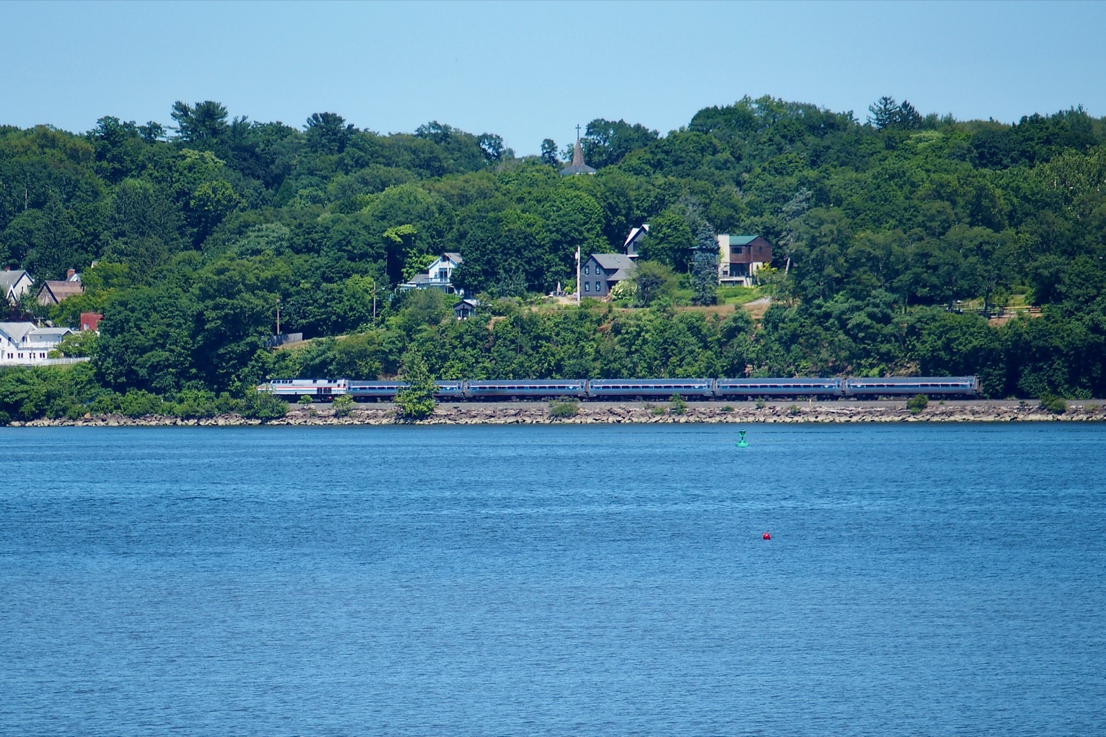 Photo of passenger train along the Hudson River