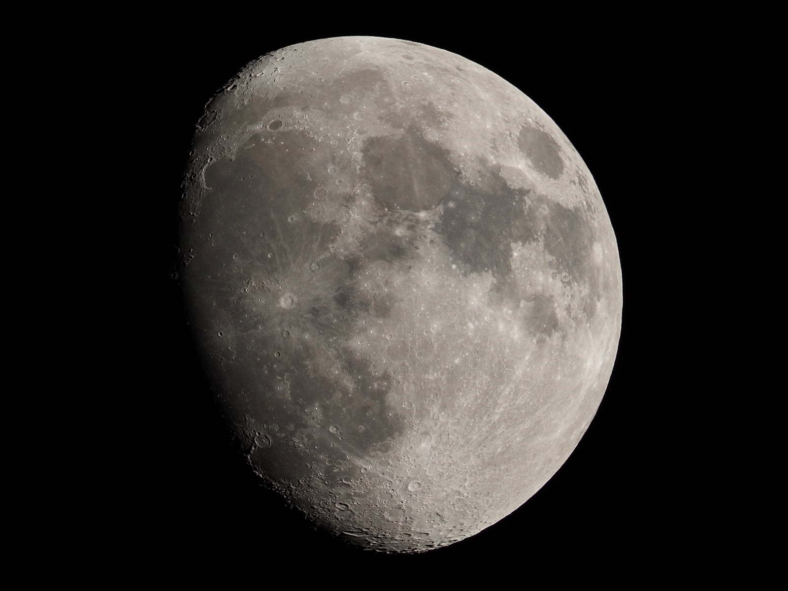 Telephoto closeup of the waxing gibbous moon.