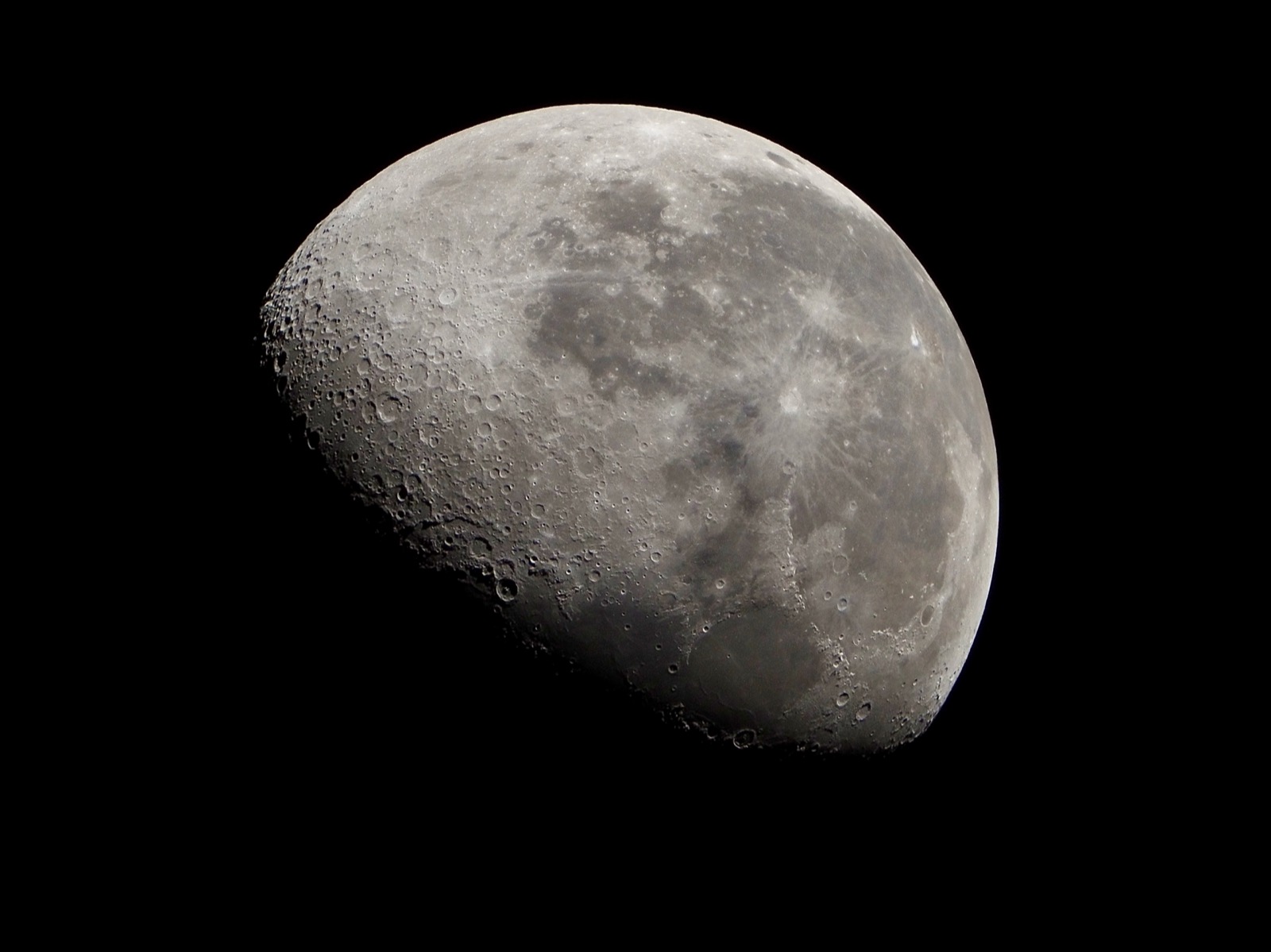 Telephoto closeup of the waning gibbous moon. 69% illuminated