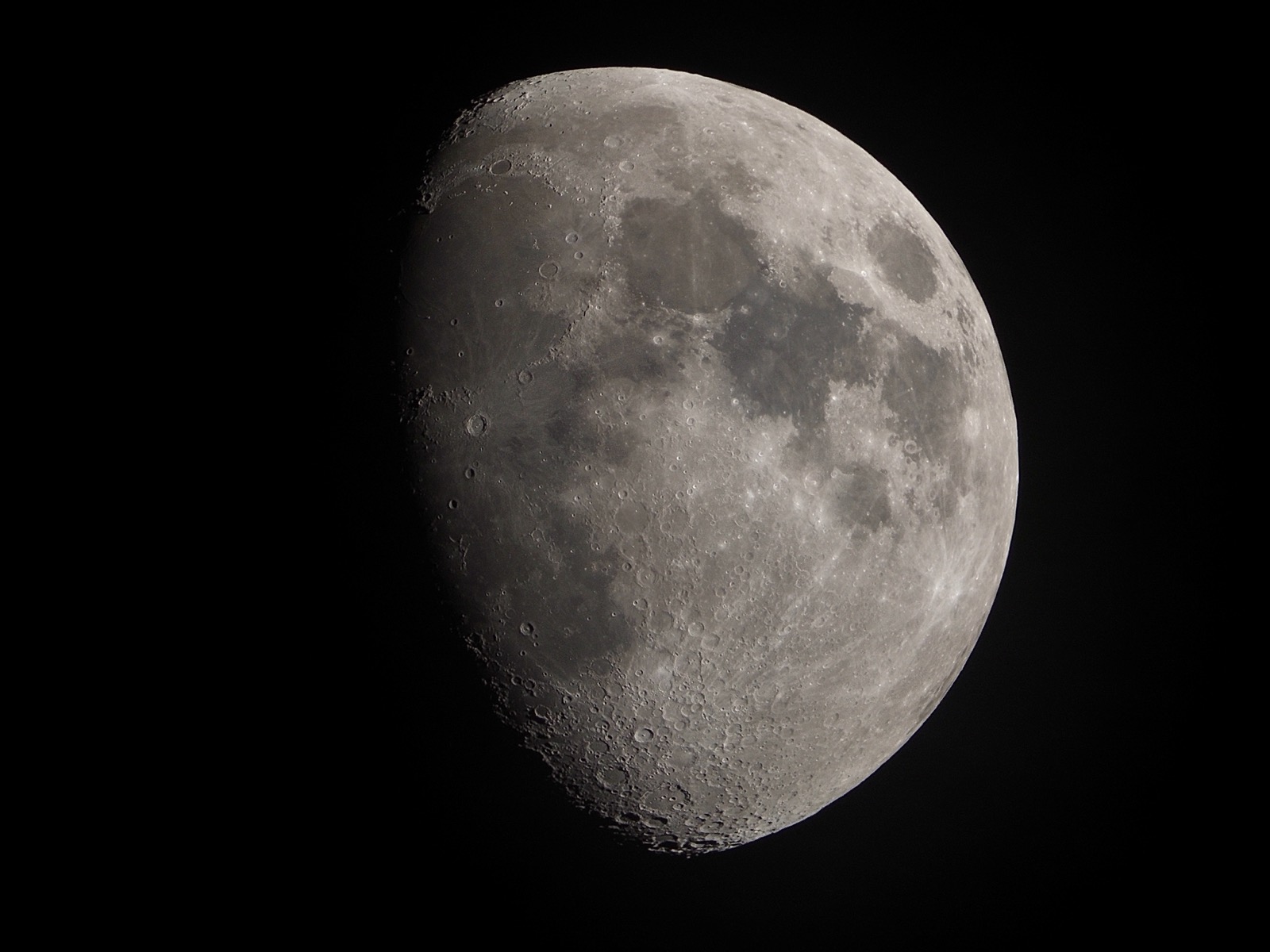 Telephoto closeup of waxing gibbous moon on 12-10-24