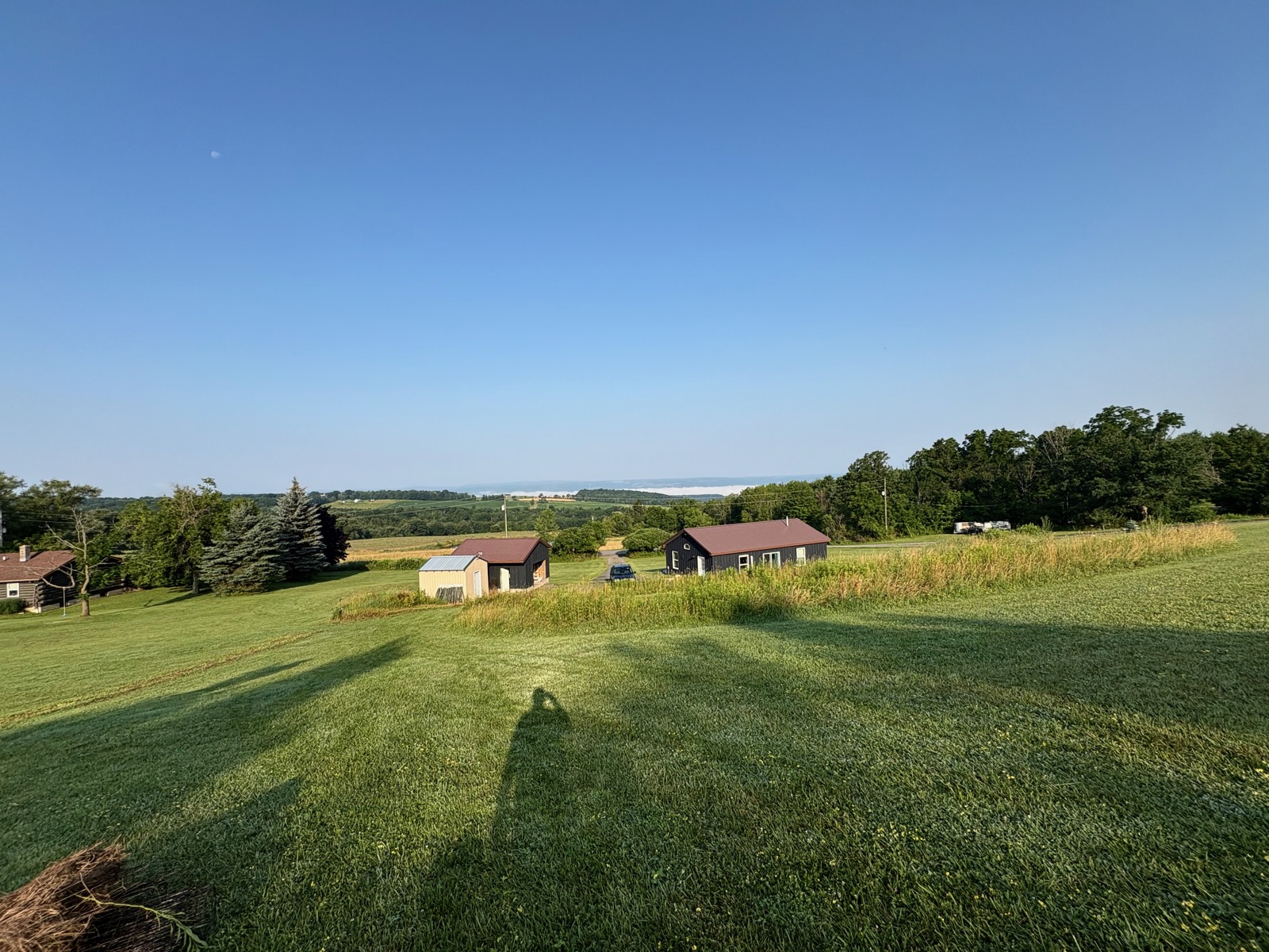 Title has nothing to do with the pic. Wideangle shot of our house in a rural setting with fog over Seneca Lake visible in the distance