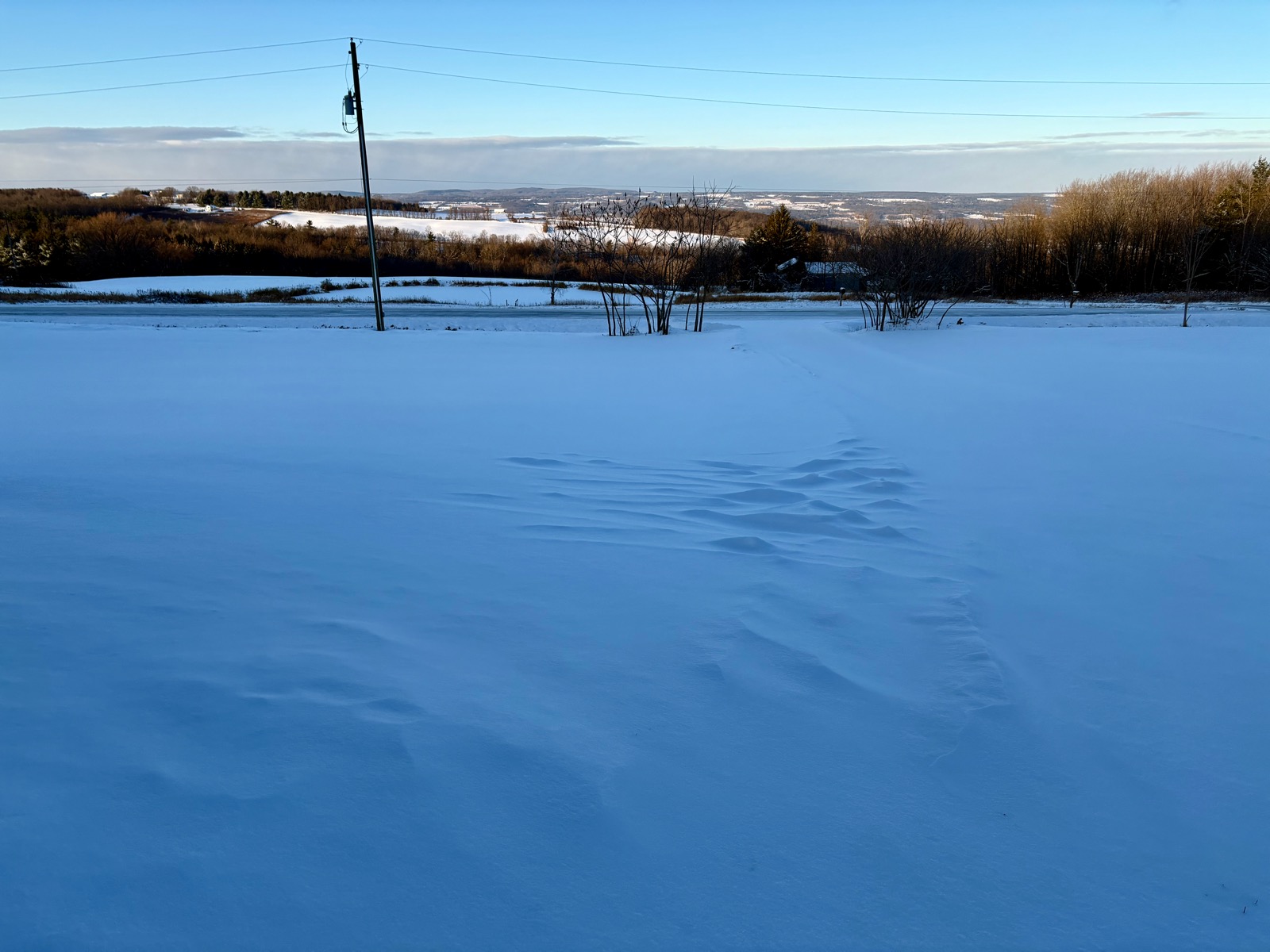 Some windblown snow ripples in shadow.
