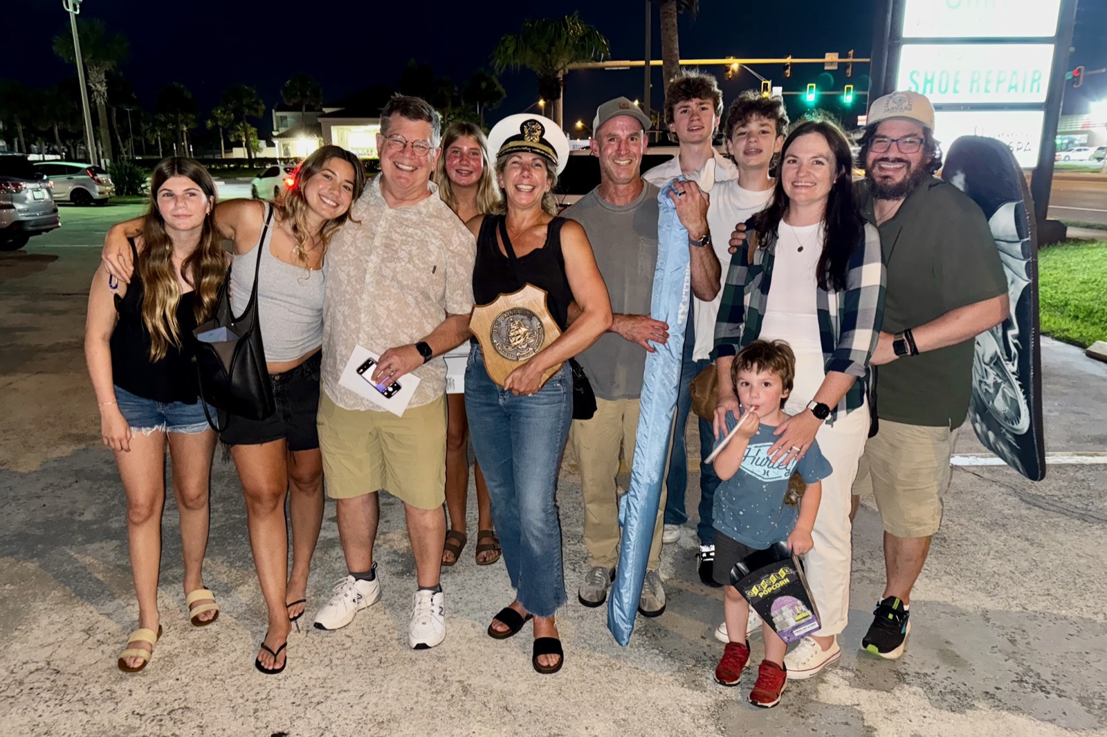 Group photo of my family at night in a parking lot