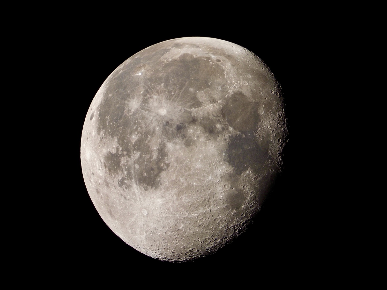 Teleophoto closeup of the waning gibbous moon 87.4% illuminated