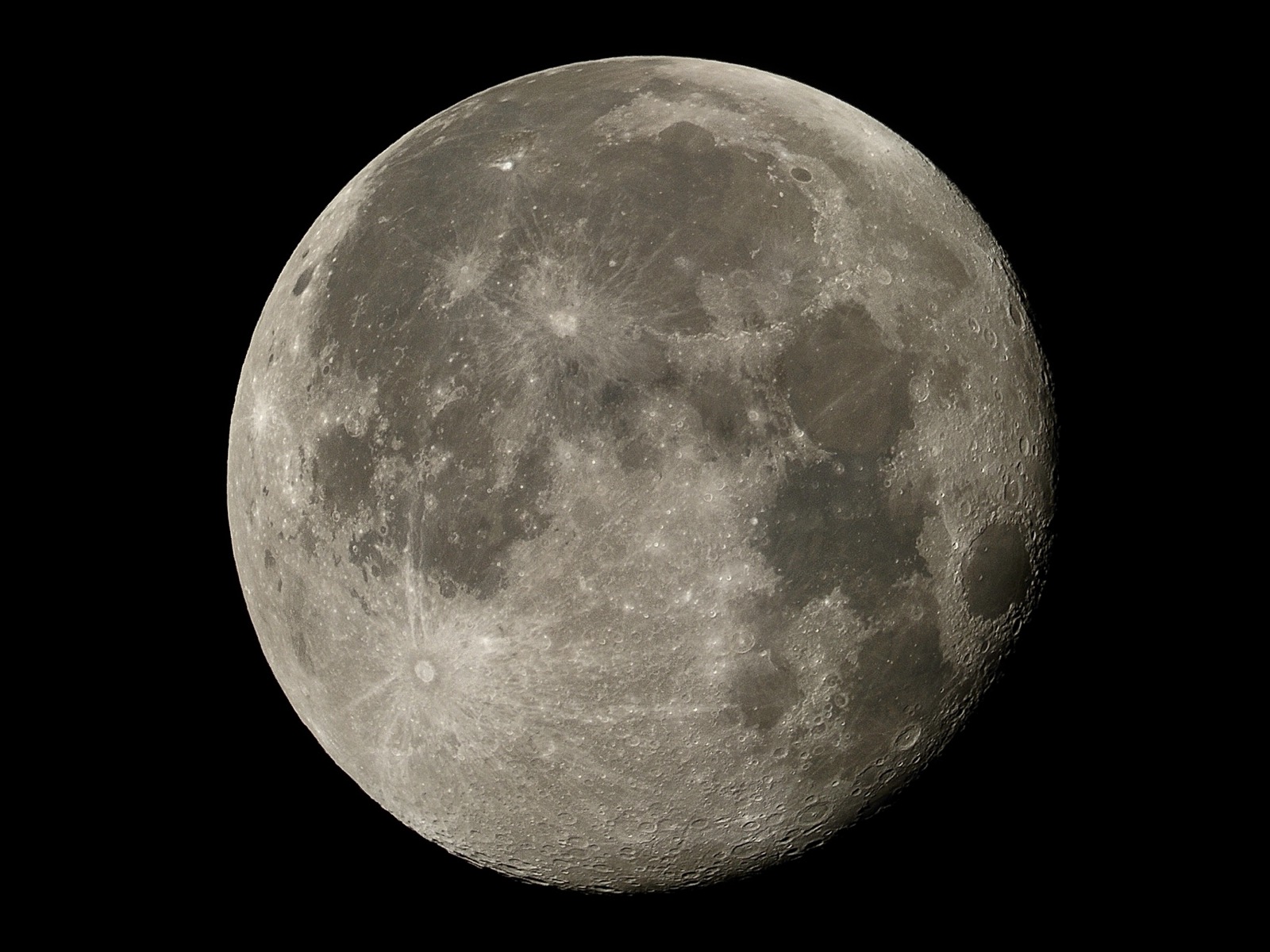 Telephoto closeup of the waning gibbous moon, 96% illuminated.