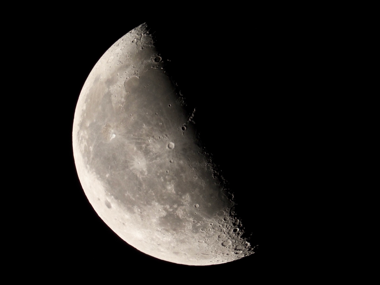 Telephoto closeup of last quarter moon 51% illuminated