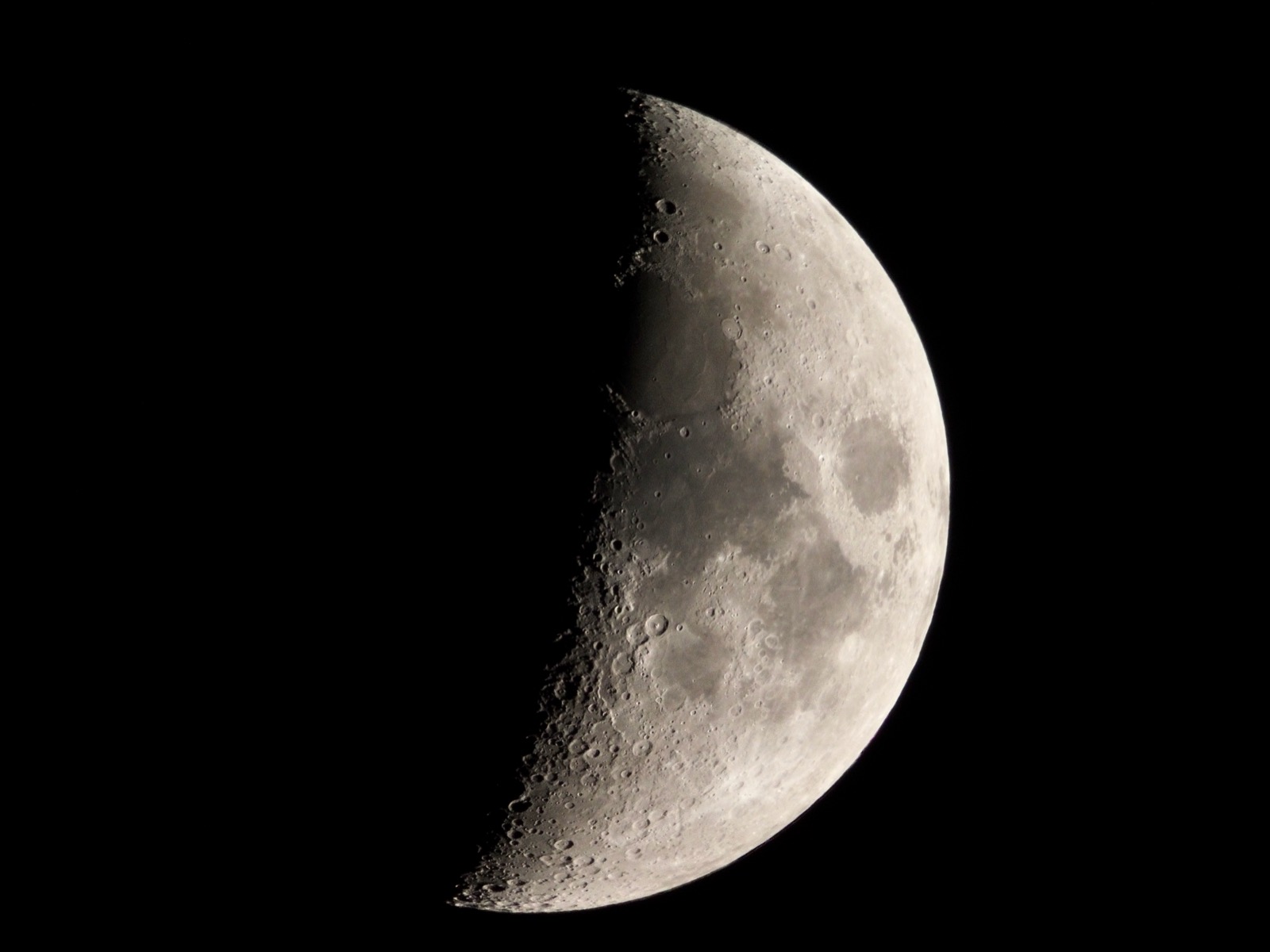 Telephoto closeup of the waxing moon