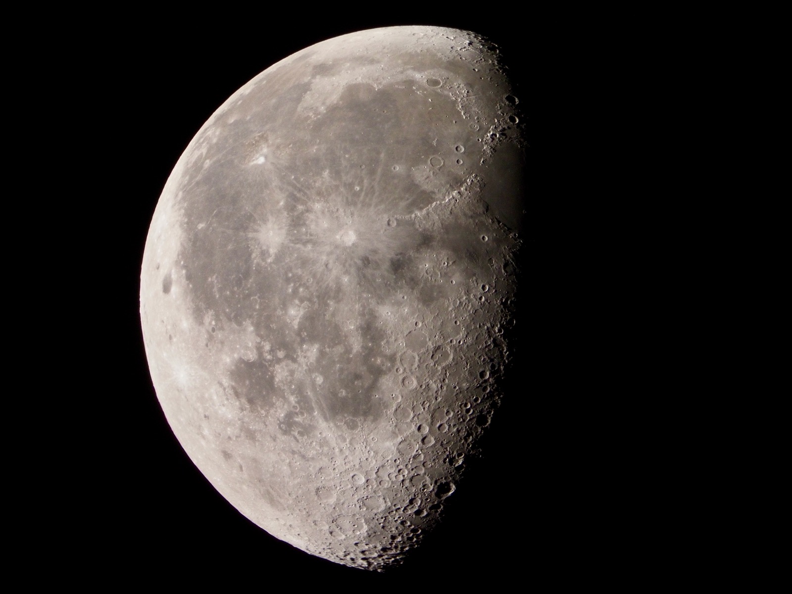 Telephoto closeup of the waning gibbous moon, 68% illuminated.