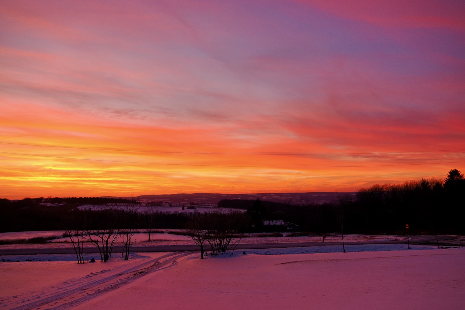 Reddish light reflected in the snow from a red sunset