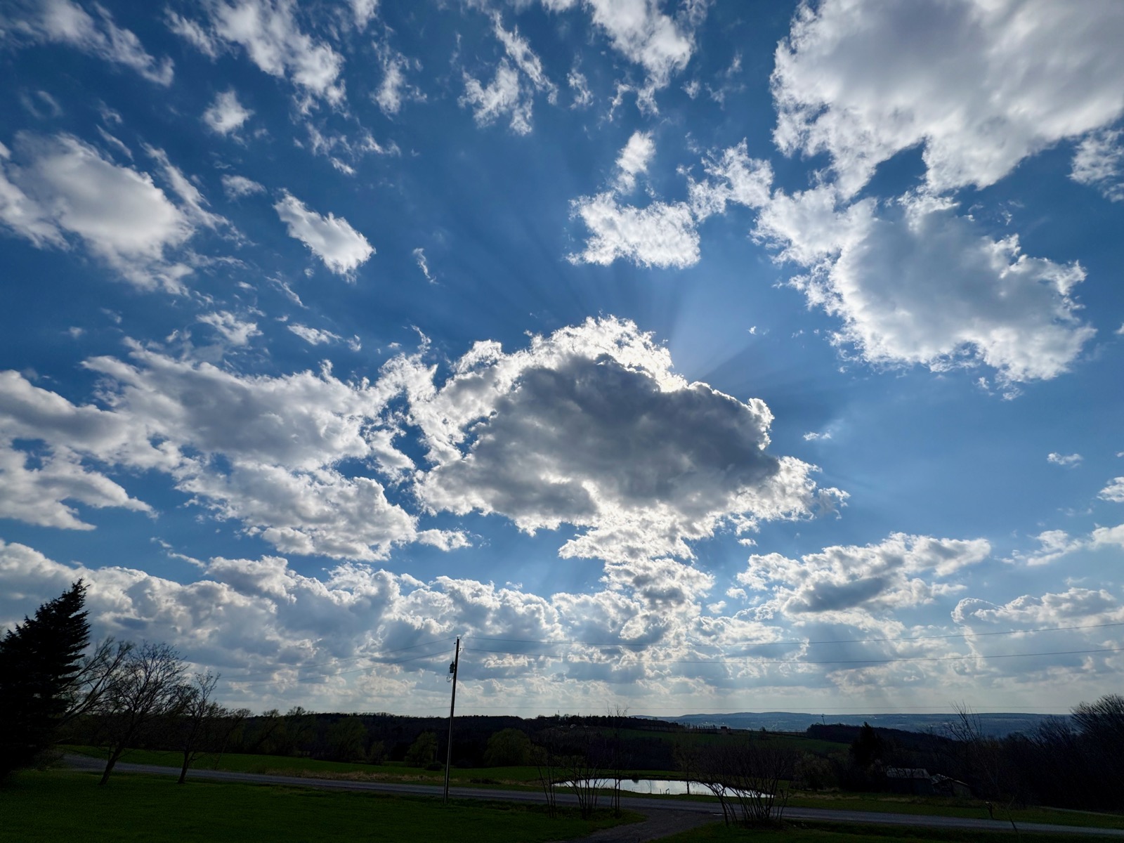 Sunbeams from a cloud backlt by the sun