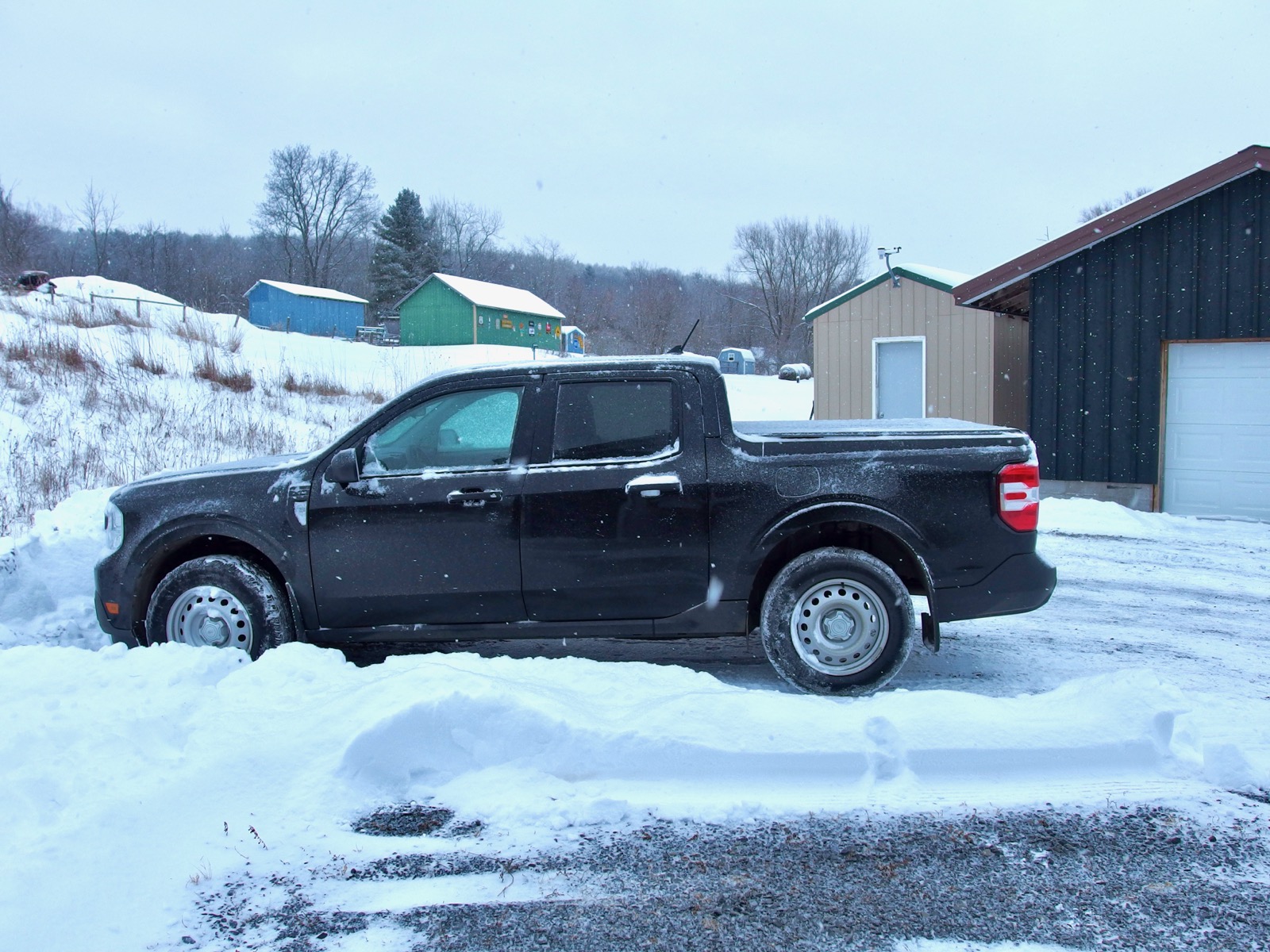 Ford Maverick in the driveway amid the snow