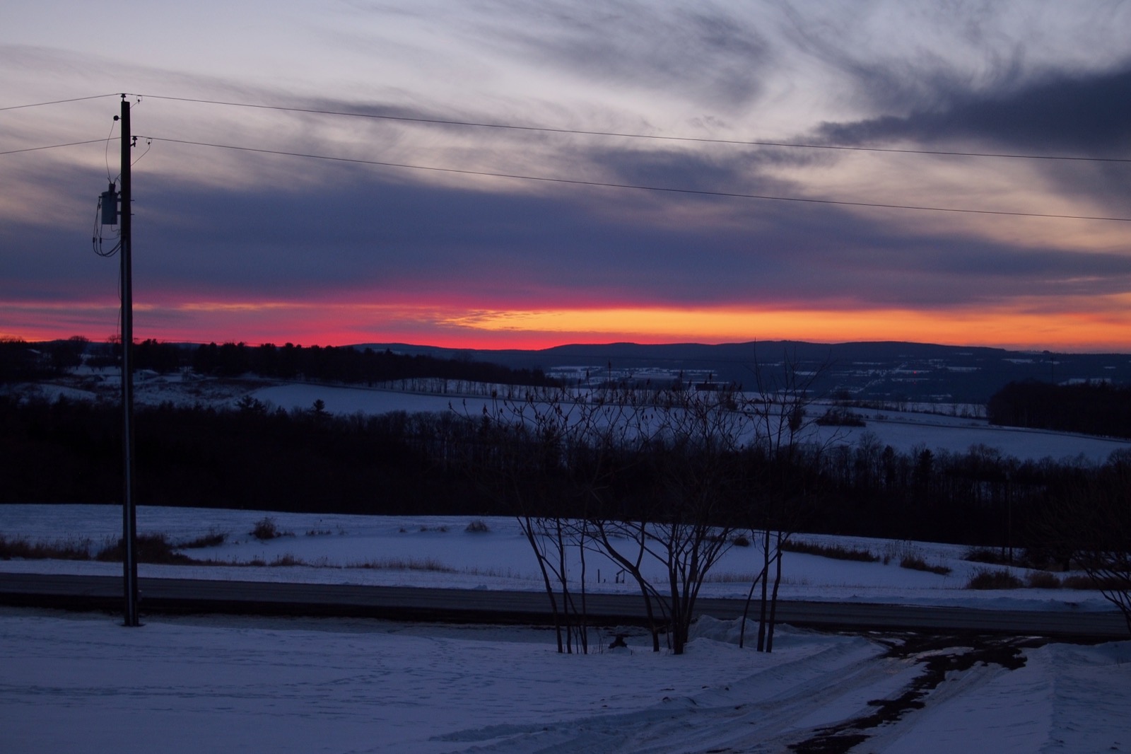 Unspectacular sunset above a rural landscape in the distance