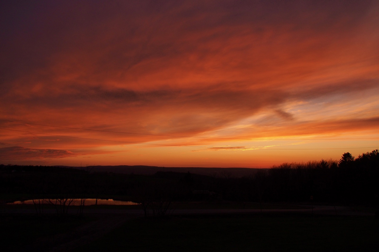 Clouds illuminated from below by the sun below the horizon