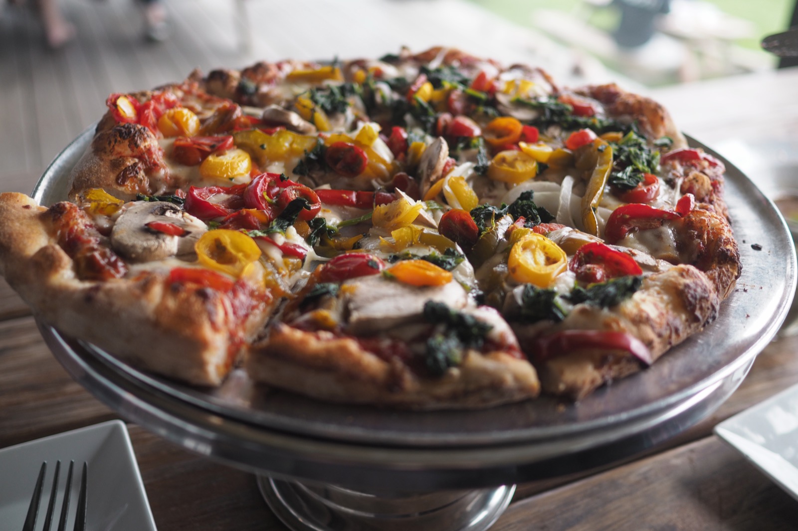 Medium Scale House Veggie Special pizza, lots of colorful toppings