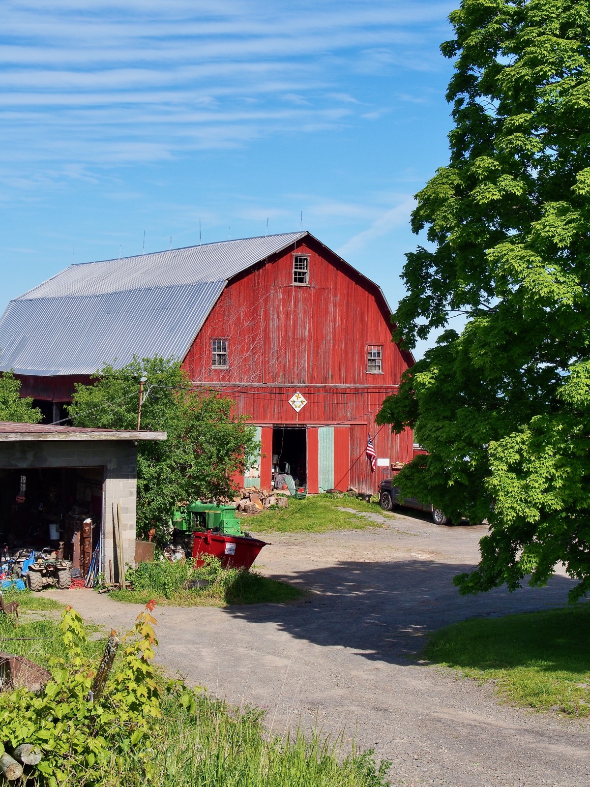 Telephoto closeup of the gable end of a red barn.