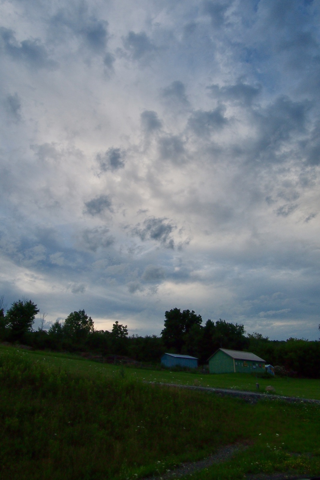 Early morning clouds above a rural landscape