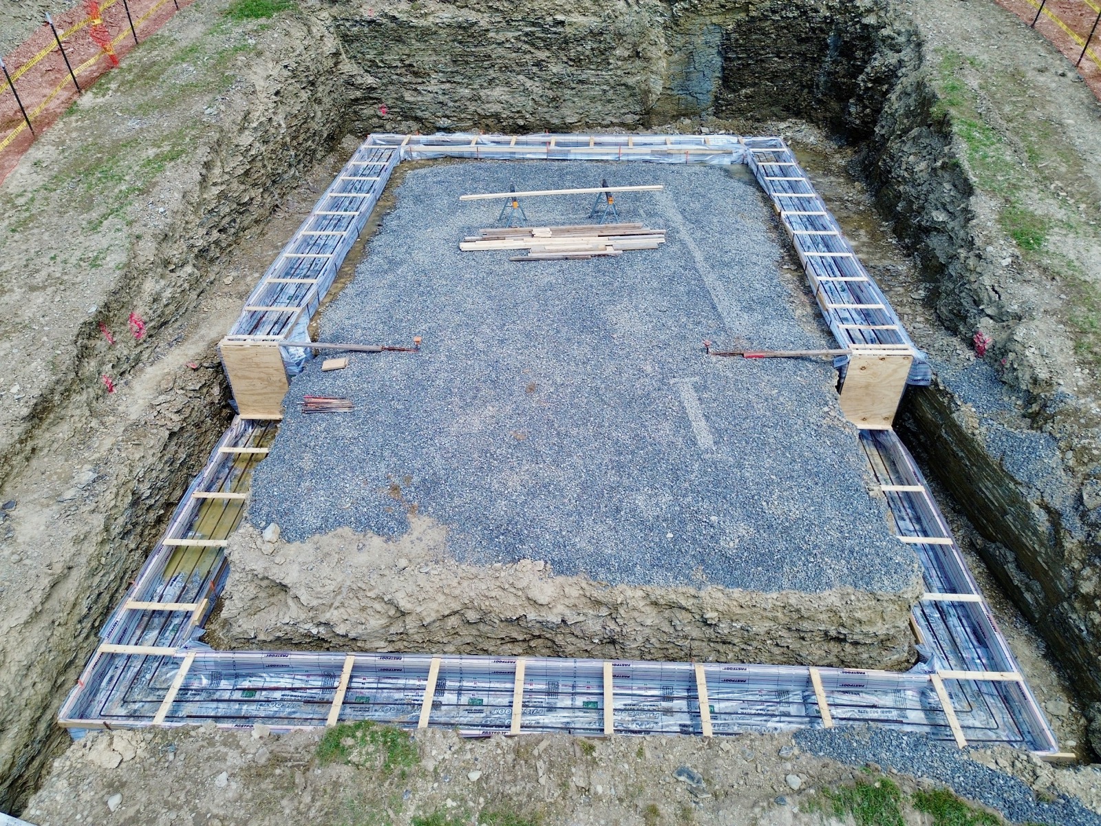 Forms and rebar for the footers of a foundation awaiting concrete